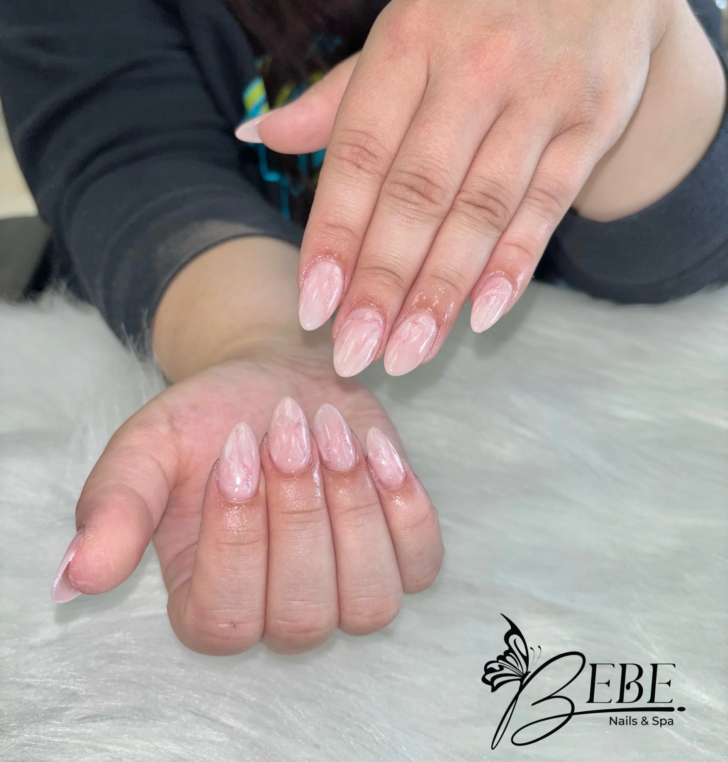 Nude nails finished with a fine gold line design